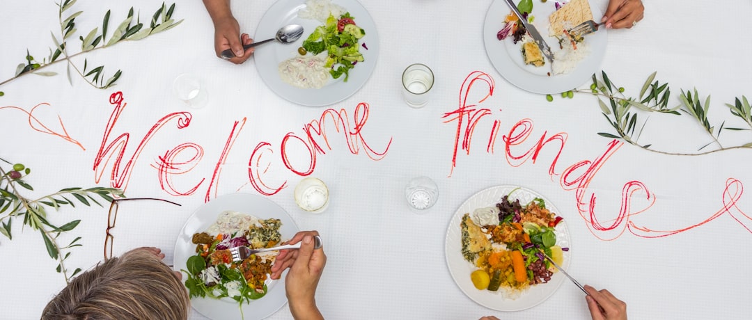 a multicultural lunch or dinner with friends around a welcome table for friends
